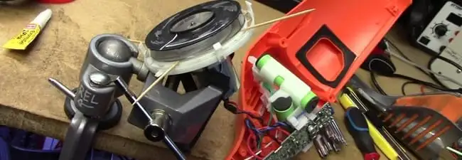 Vacuum cleaner repair parts and tools on a workbench in West Palm Beach, FL